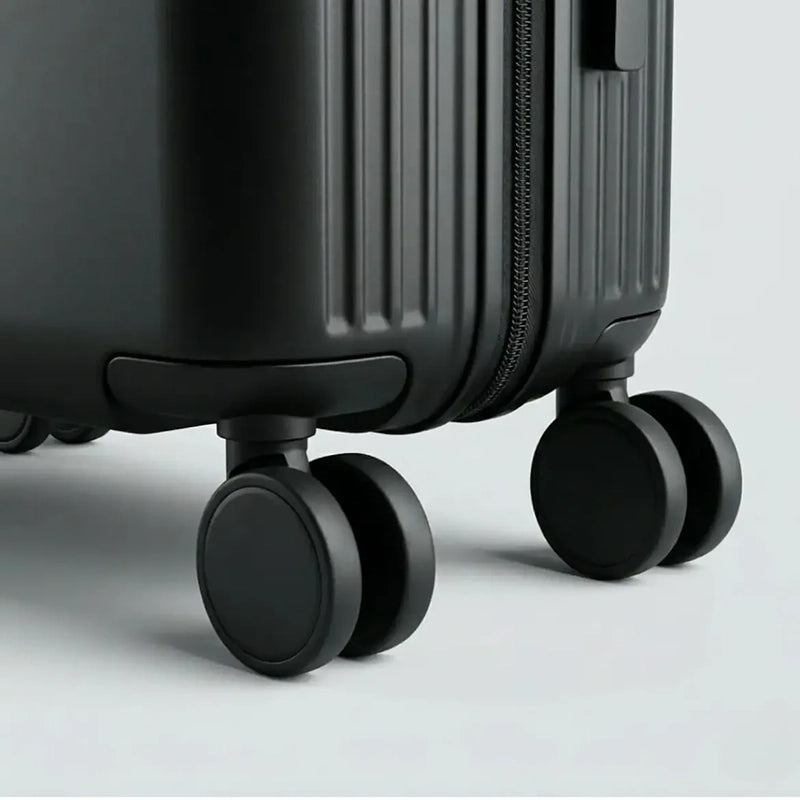 Valise à coque rigide avec surface lisse et finition mate