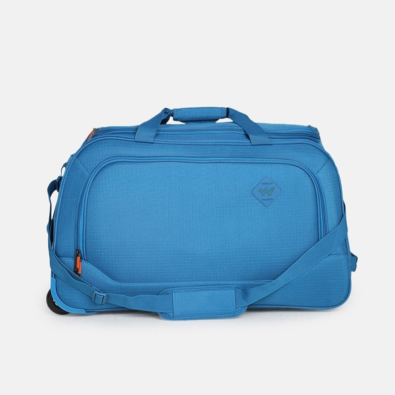 Valise cabine souple dans le compartiment bagage d'un avion